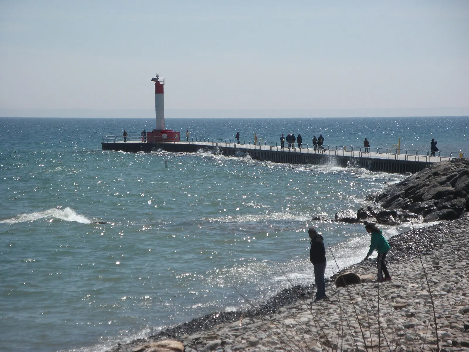 Oakville Harbour pier and lighthouse on Lake Ontario