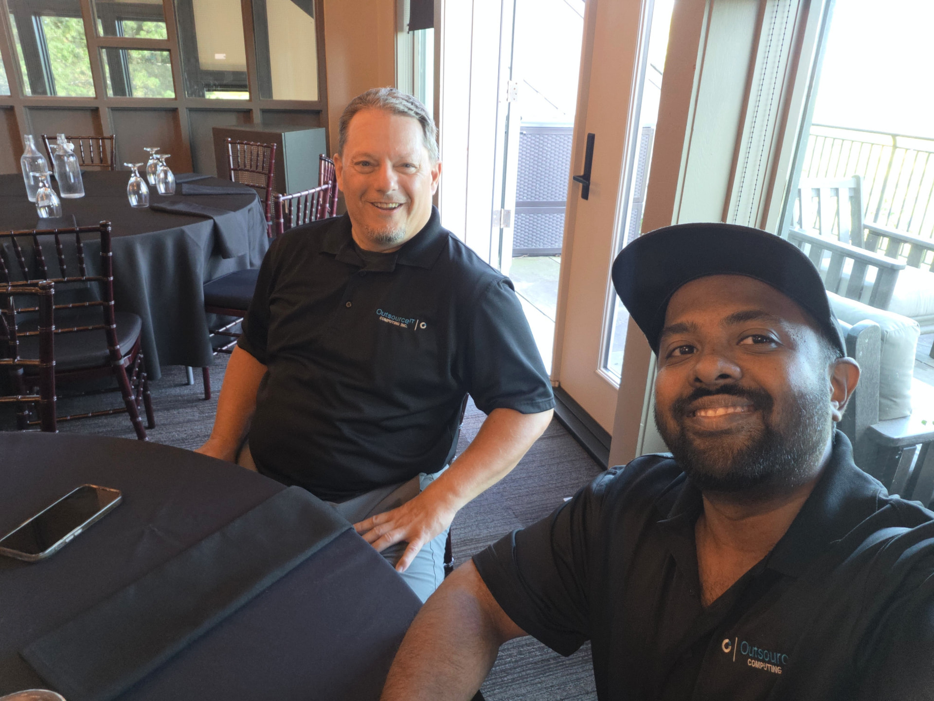 Outsource IT team members at the clubhouse before the Bethany Lodge Golf Tournament