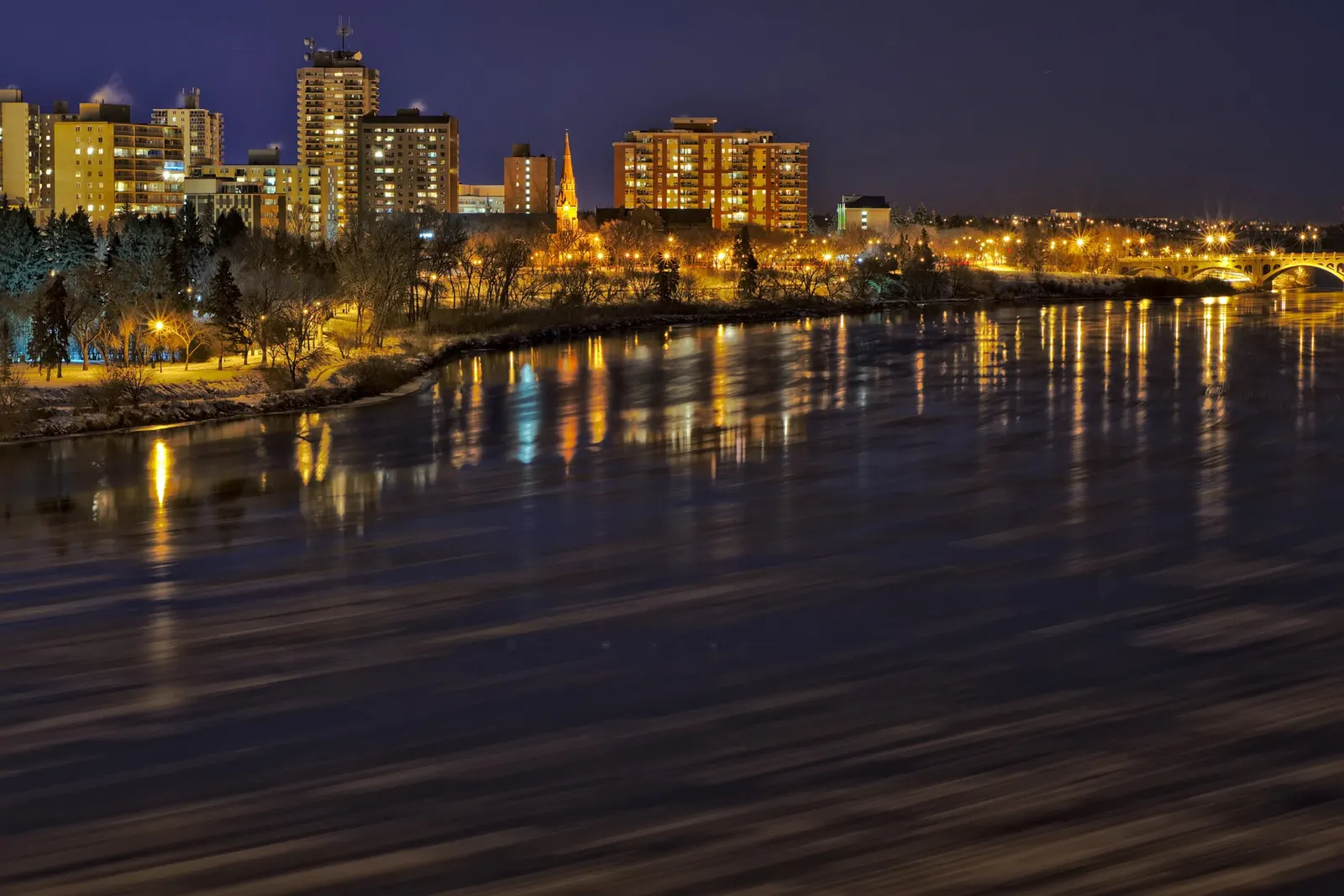 Saskatoon skyline along the South Saskatchewan River at night